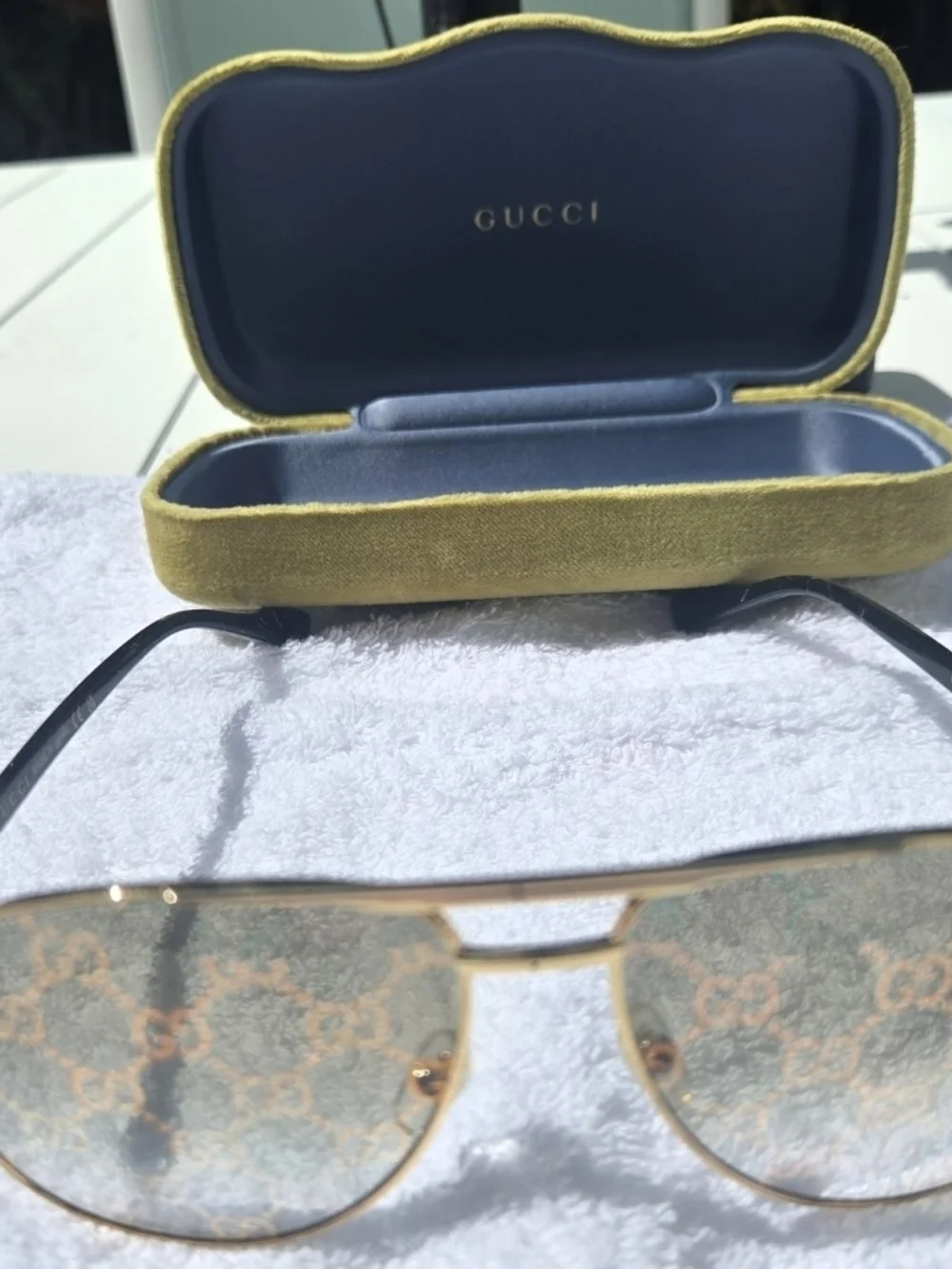 Gucci Gold Aviator Sunglasses with Black Temples and Logo-Pattern Lenses Unisex